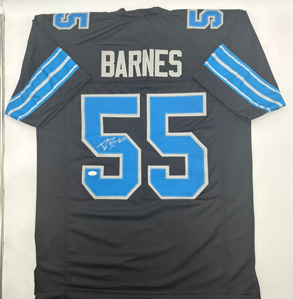 Black sports jersey with blue accents and 'Barnes' and number '55' on a white background