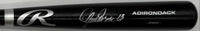 Black baseball bat with a silver logo on a white background