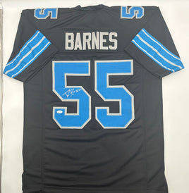 Black sports jersey with blue accents and 'Barnes' and number '55' on a white background